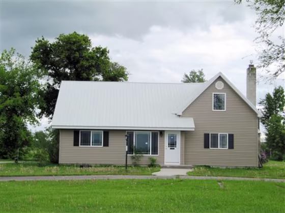 In this photo taken June 9, 2011, the residence near Rexburg, Idaho, now known locally as "The Snake House," is shown. The five-bedroom house on a nearly 2-acre lot in the eastern Idaho countryside seemed like a steal at $178,500. But it wasn't long before Ben and Amber Session realized the dream home they had purchased for their growing family was their worst nightmare: It was infested with hundreds upon hundreds of garter snakes.